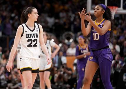Angel Reese (10) shows Iowa Caitlin Clark her ring finger during the final seconds of the women's NCAA Tournament national championship game.

Syndication Hawkcentral