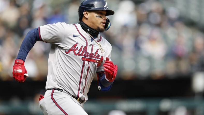 Apr 1, 2024; Chicago, Illinois, USA; Atlanta Braves shortstop Orlando Arcia (11) runs to second base after hitting a two-run double against the Chicago White Sox during the fourth inning at Guaranteed Rate Field. Mandatory Credit: Kamil Krzaczynski-USA TODAY Sports