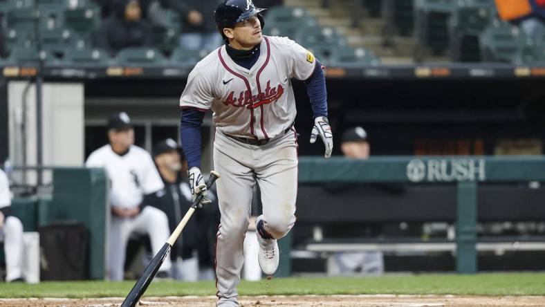 Apr 1, 2024; Chicago, Illinois, USA; Atlanta Braves third baseman Austin Riley (27) watches his three-run home run against the Chicago White Sox during the eight inning at Guaranteed Rate Field. Mandatory Credit: Kamil Krzaczynski-USA TODAY Sports