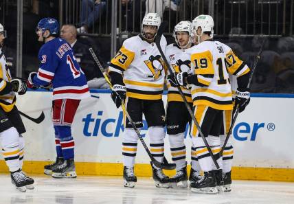 Apr 1, 2024; New York, New York, USA; Pittsburgh Penguins right wing Bryan Rust (17) celebrates his goal with Pittsburgh Penguins center Sidney Crosby (87) during the first period against the New York Rangers at Madison Square Garden. Mandatory Credit: Danny Wild-USA TODAY Sports