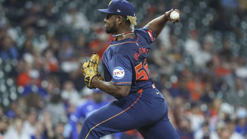 Apr 1, 2024; Houston, Texas, USA; Houston Astros starting pitcher Ronel Blanco (56) delivers a pitch during the first inning against the Toronto Blue Jays at Minute Maid Park. Mandatory Credit: Troy Taormina-USA TODAY Sports