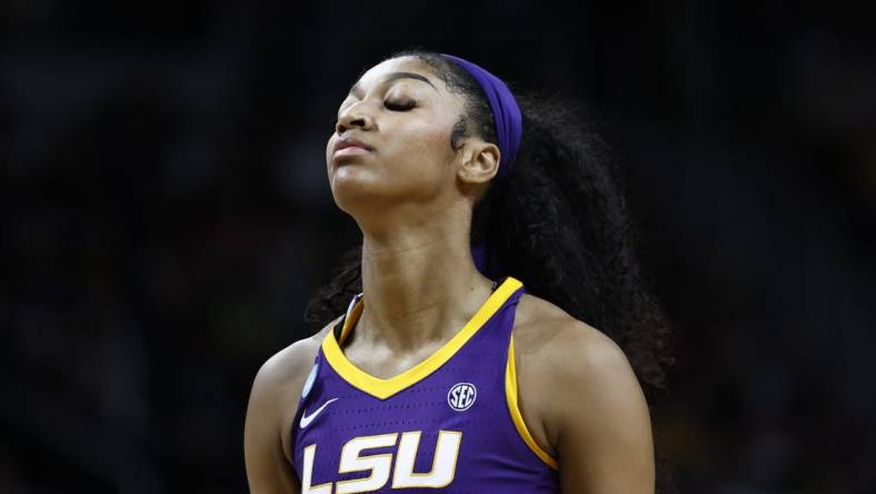 Apr 1, 2024; Albany, NY, USA; LSU Lady Tigers forward Angel Reese (10) reacts in the fourth quarter against the Iowa Hawkeyes in the finals of the Albany Regional in the 2024 NCAA Tournament at MVP Arena. Mandatory Credit: Winslow Townson-USA TODAY Sports