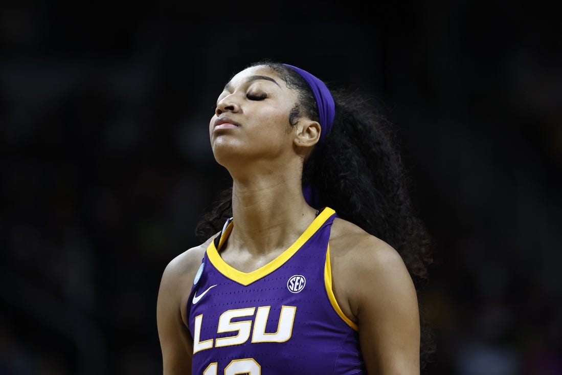 Apr 1, 2024; Albany, NY, USA; LSU Lady Tigers forward Angel Reese (10) reacts in the fourth quarter against the Iowa Hawkeyes in the finals of the Albany Regional in the 2024 NCAA Tournament at MVP Arena. Mandatory Credit: Winslow Townson-USA TODAY Sports