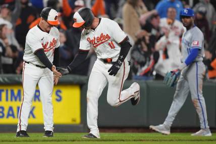 Apr 1, 2024; Baltimore, Maryland, USA; Baltimore Orioles designated hitter Jordan Westburg (11) greeted by coach Tony Mansolino (36) following his game winning two run home run in the ninth inning against the Kansas City Royals at Oriole Park at Camden Yards. Mandatory Credit: Mitch Stringer-USA TODAY Sports