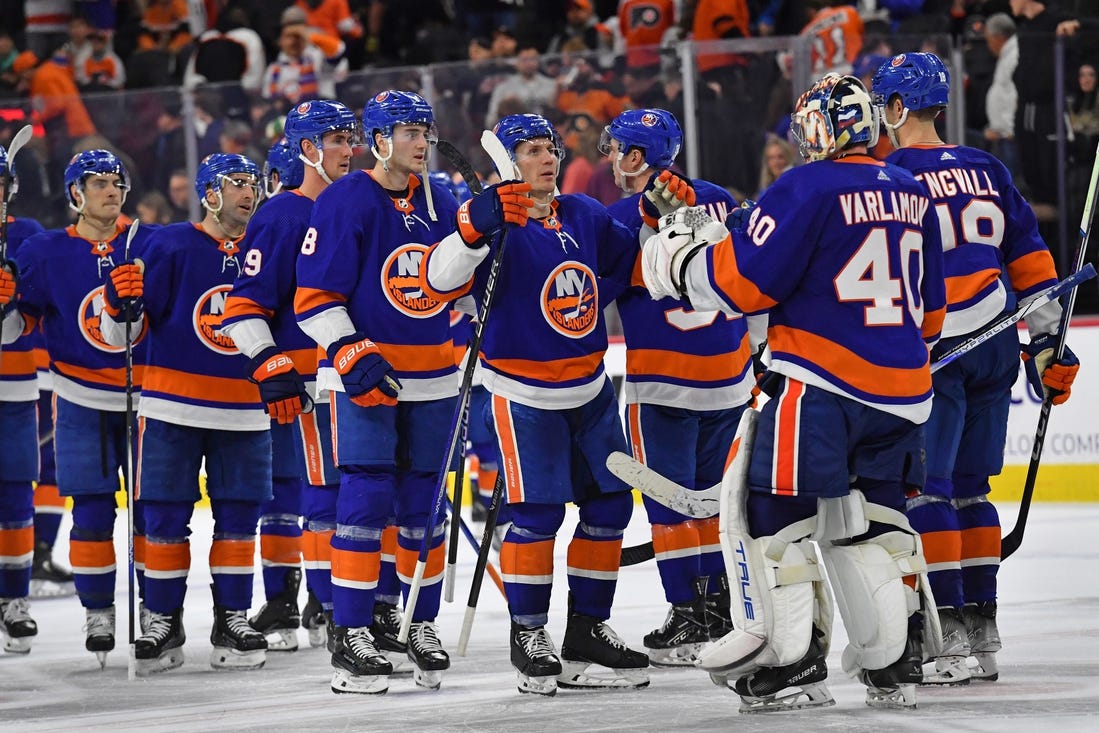 Apr 1, 2024; Philadelphia, Pennsylvania, USA; New York Islanders center Casey Cizikas (53) and goaltender Semyon Varlamov (40) celebrate win in overtime against the Philadelphia Flyers at Wells Fargo Center. Mandatory Credit: Eric Hartline-USA TODAY Sports