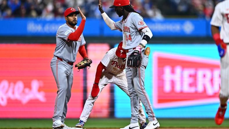 Apr 1, 2024; Philadelphia, Pennsylvania, USA; Cincinnati Reds third baseman Jeimer Candelario (3) and shortstop Elly De La Cruz (44) celebrate after a tag-out against the Philadelphia Phillies in the eighth inning at Citizens Bank Park. Mandatory Credit: Kyle Ross-USA TODAY Sports