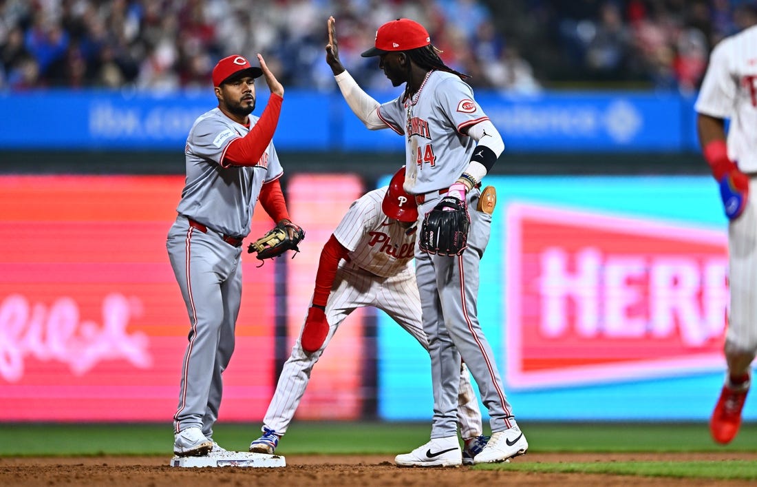 Apr 1, 2024; Philadelphia, Pennsylvania, USA; Cincinnati Reds third baseman Jeimer Candelario (3) and shortstop Elly De La Cruz (44) celebrate after a tag-out against the Philadelphia Phillies in the eighth inning at Citizens Bank Park. Mandatory Credit: Kyle Ross-USA TODAY Sports