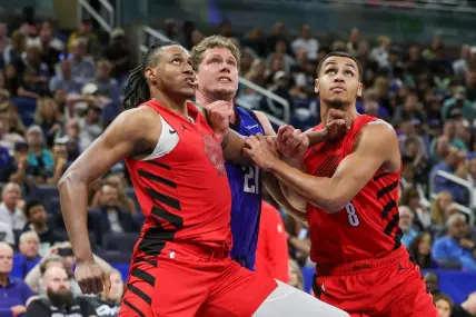 Apr 1, 2024; Orlando, Florida, USA; Portland Trail Blazers forward Jabari Walker (34) forward Kris Murray (8) and Orlando Magic center Moritz Wagner (21) look for the rebound during the second half at Amway Center. Mandatory Credit: Mike Watters-USA TODAY Sports