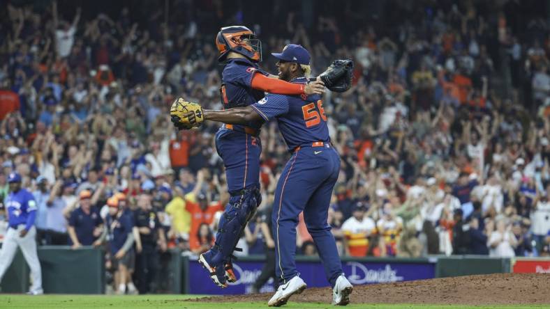 Apr 1, 2024; Houston, Texas, USA; Houston Astros starting pitcher Ronel Blanco (56) celebrates with catcher Yainer Diaz (21) after throwing a no-hitter against the Toronto Blue Jays at Minute Maid Park. Mandatory Credit: Troy Taormina-USA TODAY Sports