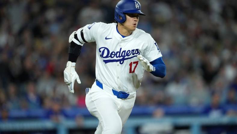 Apr 1, 2024; Los Angeles, California, USA; Los Angeles Dodgers designated hitter Shohei Ohtani (17) rounds the bases on a double in the third inning against the San Francisco Giants at Dodger Stadium. Mandatory Credit: Kirby Lee-USA TODAY Sports