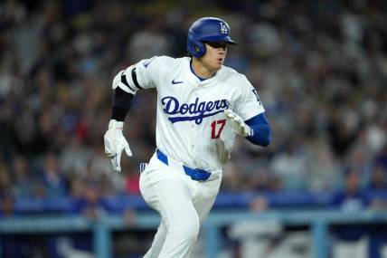 Apr 1, 2024; Los Angeles, California, USA; Los Angeles Dodgers designated hitter Shohei Ohtani (17) rounds the bases on a double in the third inning against the San Francisco Giants at Dodger Stadium. Mandatory Credit: Kirby Lee-USA TODAY Sports