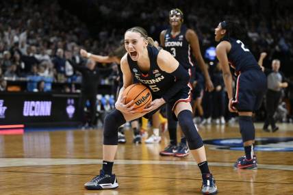 UConn Huskies guard Paige Bueckers (5) celebrates after beating the USC Trojans in the finals of the Portland Regional of the NCAA Tournament at the Moda Center. Mandatory Credit: Troy Wayrynen-USA TODAY Sports