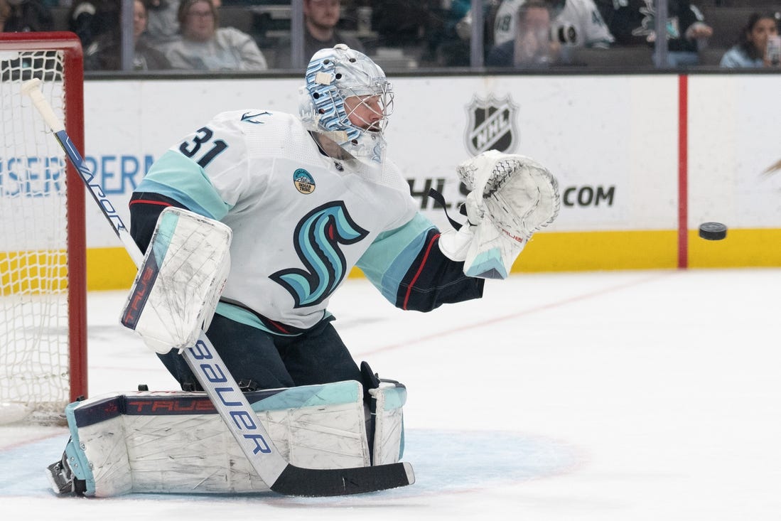 Apr 1, 2024; San Jose, California, USA; Seattle Kraken goaltender Philipp Grubauer (31) prepares to catch the puck during the second period against the San Jose Sharks at SAP Center at San Jose. Mandatory Credit: Stan Szeto-USA TODAY Sports