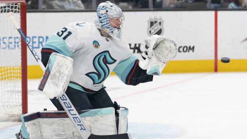 Apr 1, 2024; San Jose, California, USA; Seattle Kraken goaltender Philipp Grubauer (31) prepares to catch the puck during the second period against the San Jose Sharks at SAP Center at San Jose. Mandatory Credit: Stan Szeto-USA TODAY Sports