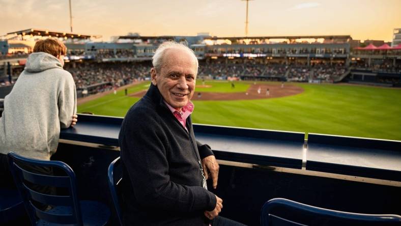 Larry Lucchino, pictured here in a 2023 photo at Polar Park in Worcester, Mass., was a driving force behind the construction or renovation of five baseball stadiums during his 27-year association with the game.