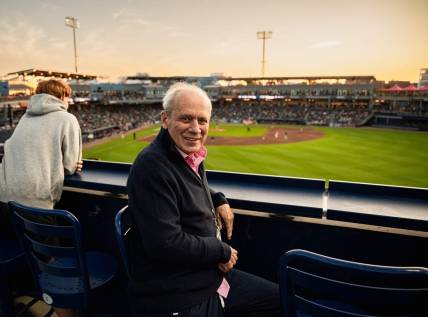 Larry Lucchino, pictured here in a 2023 photo at Polar Park in Worcester, Mass., was a driving force behind the construction or renovation of five baseball stadiums during his 27-year association with the game.
