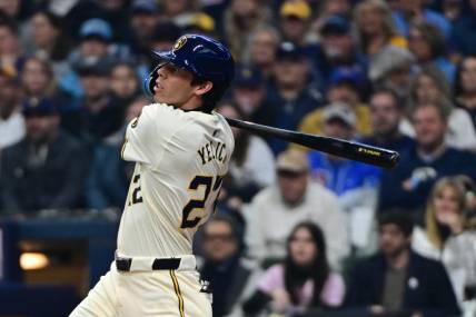 Apr 2, 2024; Milwaukee, Wisconsin, USA; Milwaukee Brewers left fielder Christian Yelich (22) hits a solo home run in the third inning against the Minnesota Twins at American Family Field. Mandatory Credit: Benny Sieu-USA TODAY Sports