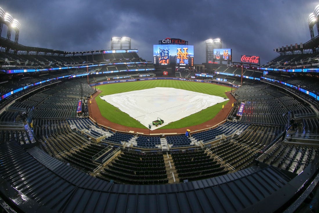 Apr 2, 2024; New York City, New York, USA;  The tarp is placed on the field during a rain delay prior to the game between the Detroit Tigers and the New York Mets at Citi Field. Mandatory Credit: Wendell Cruz-USA TODAY Sports