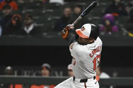 Apr 2, 2024; Baltimore, Maryland, USA; Baltimore Orioles outfielder Colton Cowser swings through a third inning rbi double against the Kansas City Royals  at Oriole Park at Camden Yards. Mandatory Credit: Tommy Gilligan-USA TODAY Sports