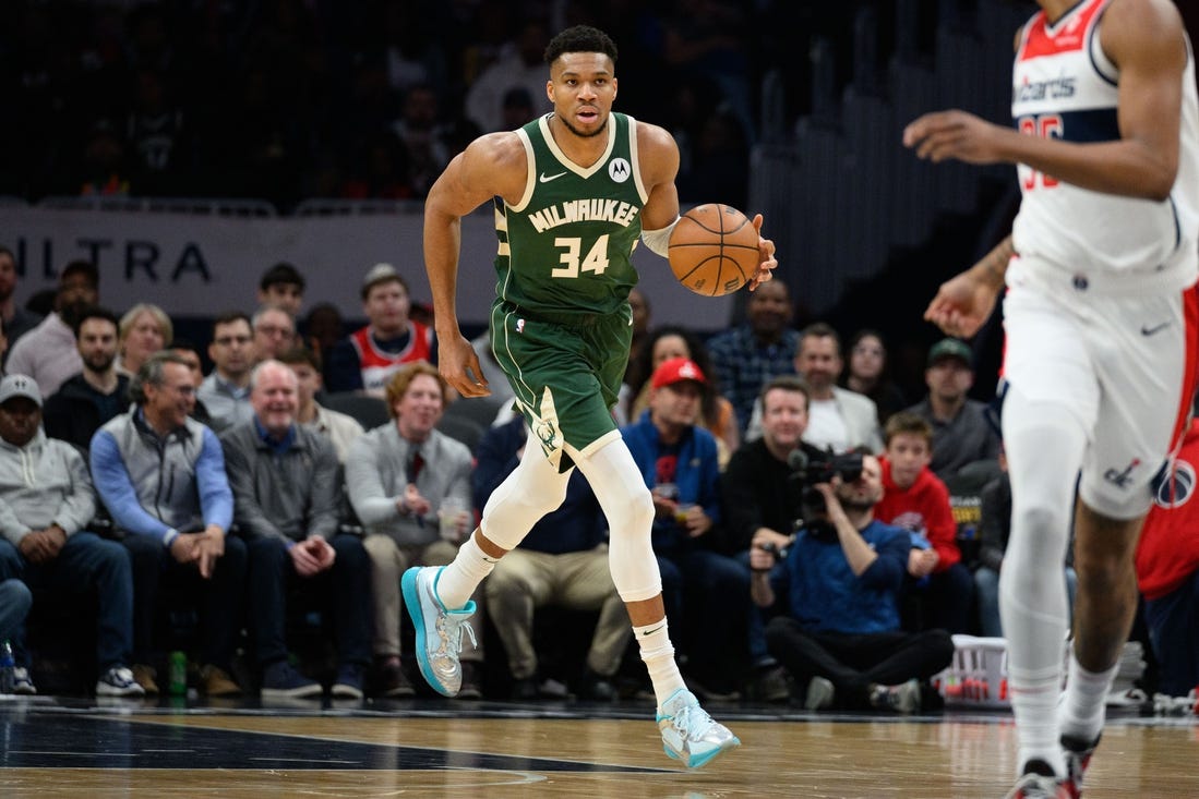 Apr 2, 2024; Washington, District of Columbia, USA; Milwaukee Bucks forward Giannis Antetokounmpo (34) brings the ball up court during the first quarter at Capital One Arena. Mandatory Credit: Reggie Hildred-USA TODAY Sports