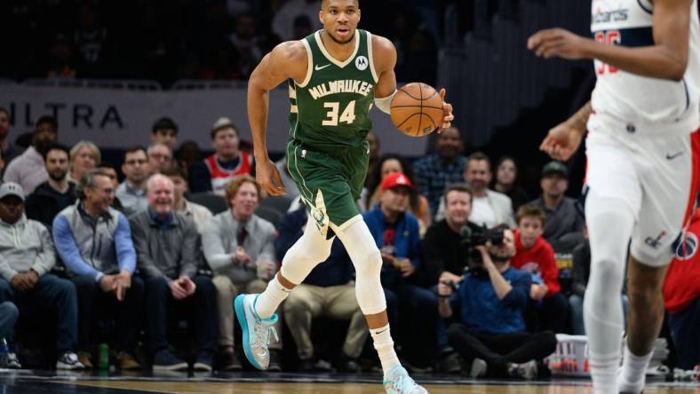 Apr 2, 2024; Washington, District of Columbia, USA; Milwaukee Bucks forward Giannis Antetokounmpo (34) brings the ball up court during the first quarter at Capital One Arena. Mandatory Credit: Reggie Hildred-USA TODAY Sports