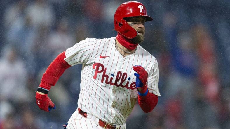 Apr 2, 2024; Philadelphia, Pennsylvania, USA; Philadelphia Phillies first baseman Bryce Harper (3) runs the bases after hitting his second home run of the game during the fourth inning against the Cincinnati Reds at Citizens Bank Park. Mandatory Credit: Bill Streicher-USA TODAY Sports