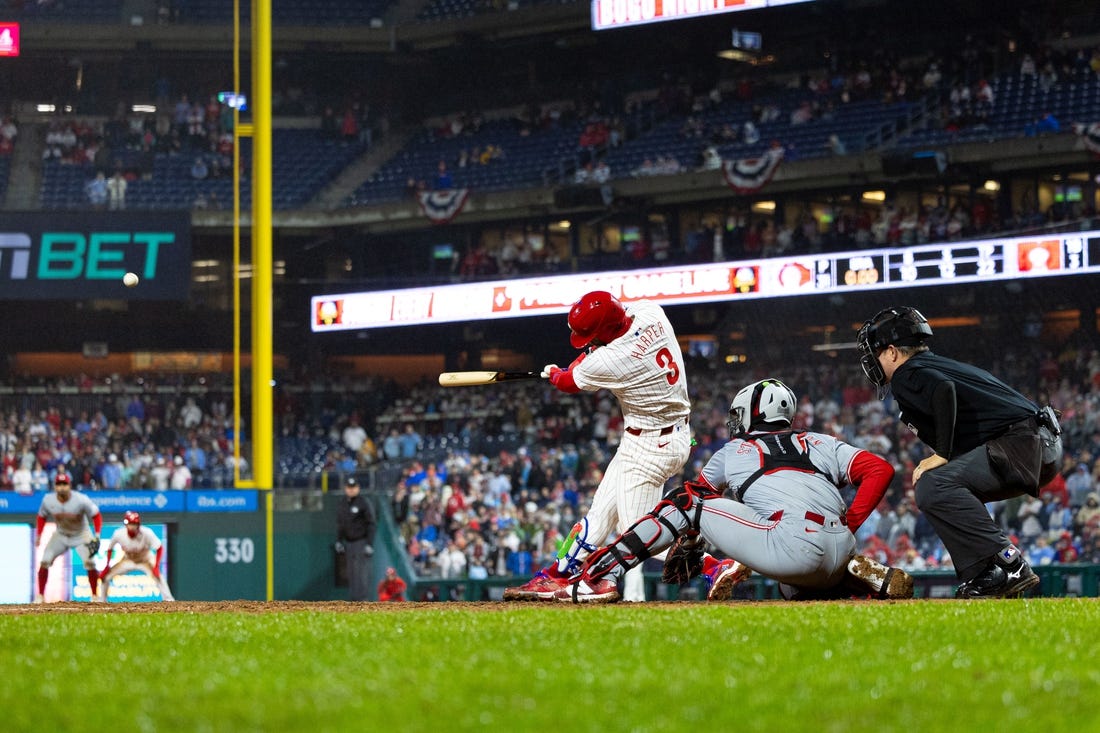 Apr 2, 2024; Philadelphia, Pennsylvania, USA; Philadelphia Phillies first baseman Bryce Harper (3) hits a four RBI grand slam during the seventh inning against the Cincinnati Reds at Citizens Bank Park. Mandatory Credit: Bill Streicher-USA TODAY Sports