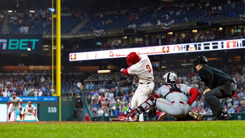 Apr 2, 2024; Philadelphia, Pennsylvania, USA; Philadelphia Phillies first baseman Bryce Harper (3) hits a four RBI grand slam during the seventh inning against the Cincinnati Reds at Citizens Bank Park. Mandatory Credit: Bill Streicher-USA TODAY Sports