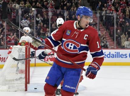 Apr 2, 2024; Montreal, Quebec, CAN; Montreal Canadiens forward Nick Suzuki (14) celebrates after scoring a goal against the Florida Panthers during the second period at the Bell Centre. Mandatory Credit: Eric Bolte-USA TODAY Sports