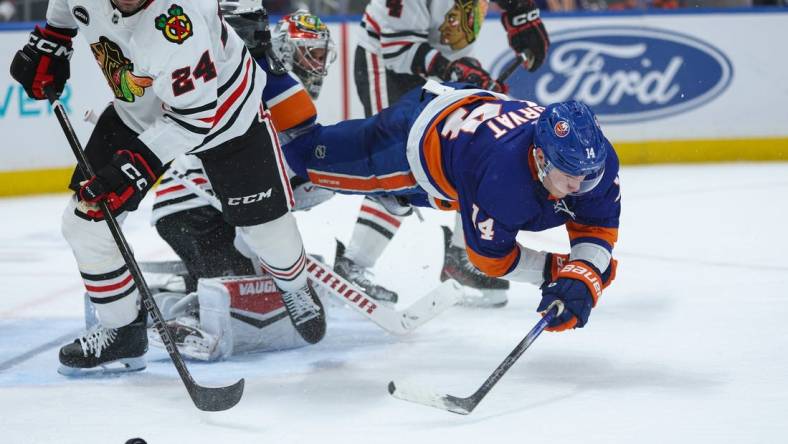 Apr 2, 2024; Elmont, New York, USA; New York Islanders center Bo Horvat (14) after shot in front of the goal against the Chicago Blackhawks during the second period at UBS Arena. Mandatory Credit: Thomas Salus-USA TODAY Sports