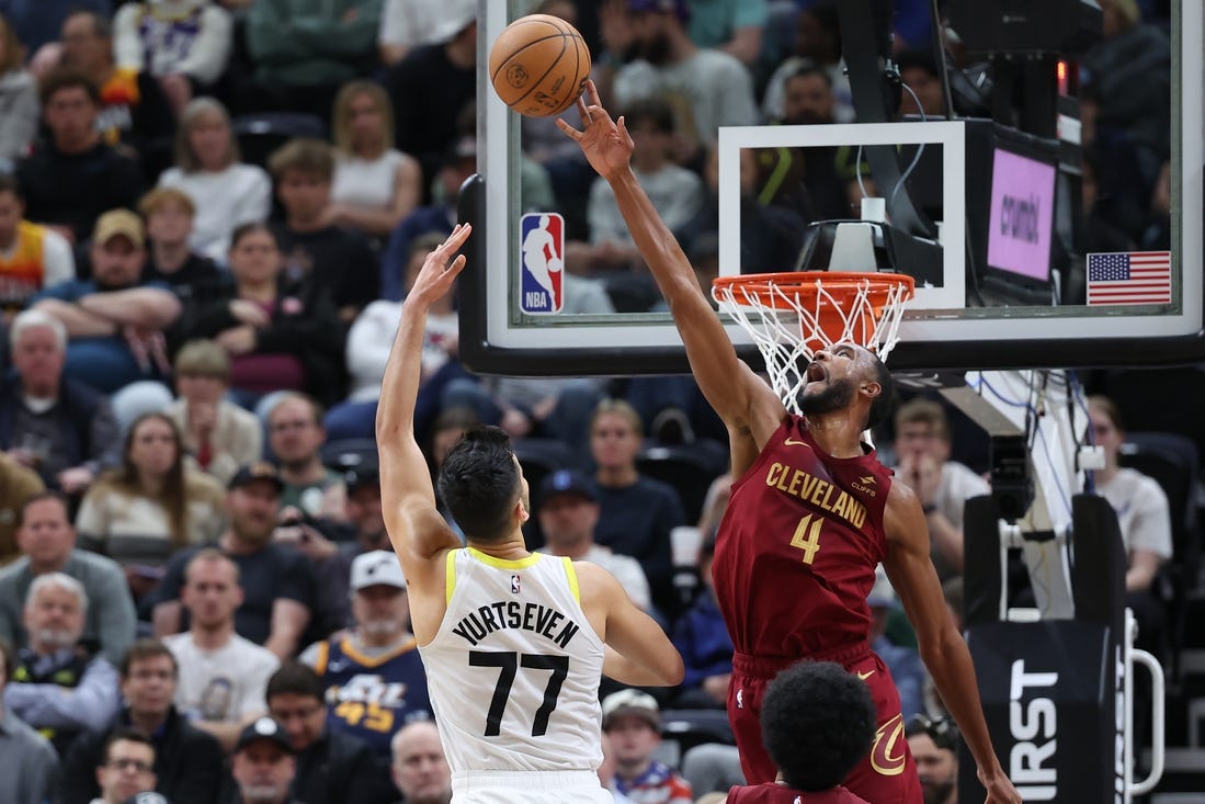 Apr 2, 2024; Salt Lake City, Utah, USA; Cleveland Cavaliers forward Evan Mobley (4) blocks the shot of Utah Jazz center Omer Yurtseven (77) during the second quarter at Delta Center. Mandatory Credit: Rob Gray-USA TODAY Sports