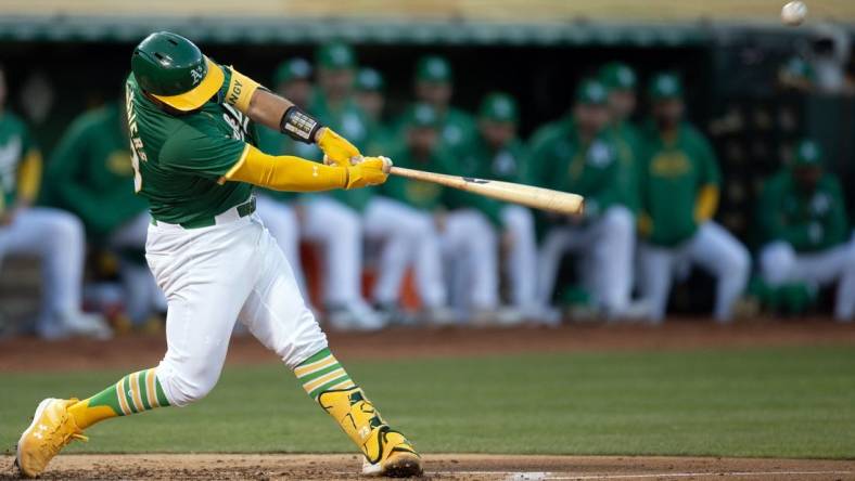 Apr 2, 2024; Oakland, California, USA; Oakland Athletics catcher Shea Langeliers (23) hits a two-run home run against the Boston Red Sox during the second inning at Oakland-Alameda County Coliseum. Mandatory Credit: D. Ross Cameron-USA TODAY Sports