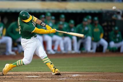 Apr 2, 2024; Oakland, California, USA; Oakland Athletics catcher Shea Langeliers (23) hits a two-run home run against the Boston Red Sox during the second inning at Oakland-Alameda County Coliseum. Mandatory Credit: D. Ross Cameron-USA TODAY Sports