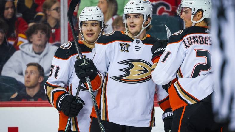 Apr 2, 2024; Calgary, Alberta, CAN; Anaheim Ducks right wing Troy Terry (19) celebrates his goal with teammates against the Calgary Flames during the second period at Scotiabank Saddledome. Mandatory Credit: Sergei Belski-USA TODAY Sports