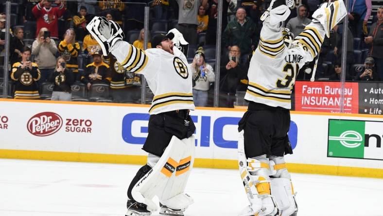 Apr 2, 2024; Nashville, Tennessee, USA; Boston Bruins goaltender Linus Ullmark (35) celebrates with goaltender Jeremy Swayman (1) after a win against the Nashville Predators at Bridgestone Arena. Mandatory Credit: Christopher Hanewinckel-USA TODAY Sports