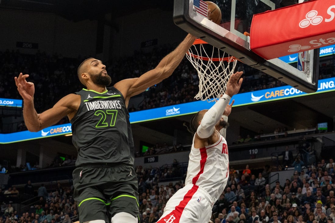 Apr 2, 2024; Minneapolis, Minnesota, USA; Minnesota Timberwolves center Rudy Gobert (27) blocks a shot by Houston Rockets forward Dillon Brooks (9) in the fourth quarter at Target Center. Mandatory Credit: Matt Blewett-USA TODAY Sports