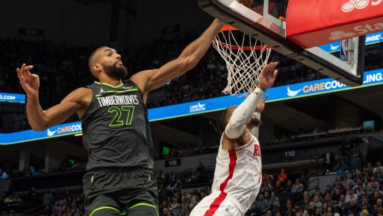 Apr 2, 2024; Minneapolis, Minnesota, USA; Minnesota Timberwolves center Rudy Gobert (27) blocks a shot by Houston Rockets forward Dillon Brooks (9) in the fourth quarter at Target Center. Mandatory Credit: Matt Blewett-USA TODAY Sports