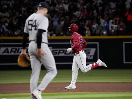 Arizona Diamondbacks first baseman Christian Walker (53) rounds the bases after hitting a three-run home run against New York Yankees pitcher Jake Cousins (54) during the seventh inning at Chase Field in Phoenix on April 2, 2024.