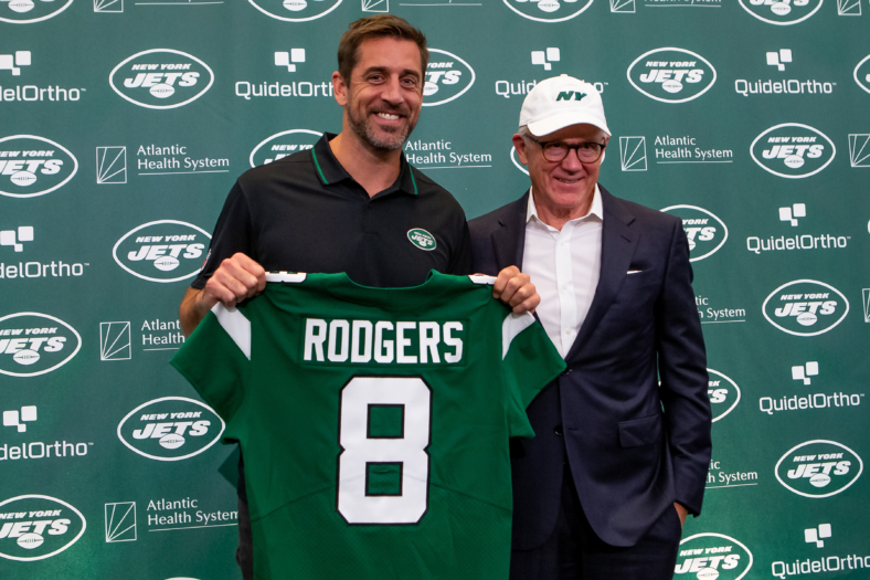 Aaron Rodgers and Woody Johnson