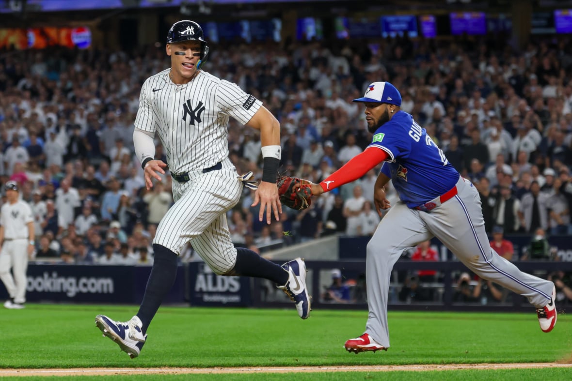 MLB: Aaron Judge caught in rundown with Vladimir Guerrero Jr. Playoffs-Toronto Blue Jays at New York Yankees