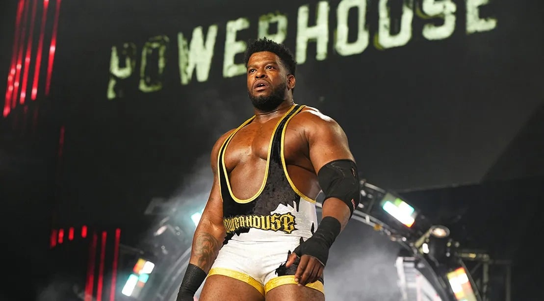 https://sportsnaut.com/wp-content/uploads/2025/12/Powerhouse-Hobbs-walking-out-to-the-wrestling-ring.jpg